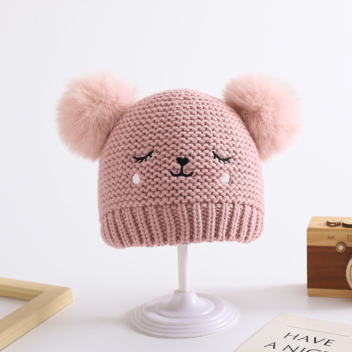 Children's woolen hat with fur ball