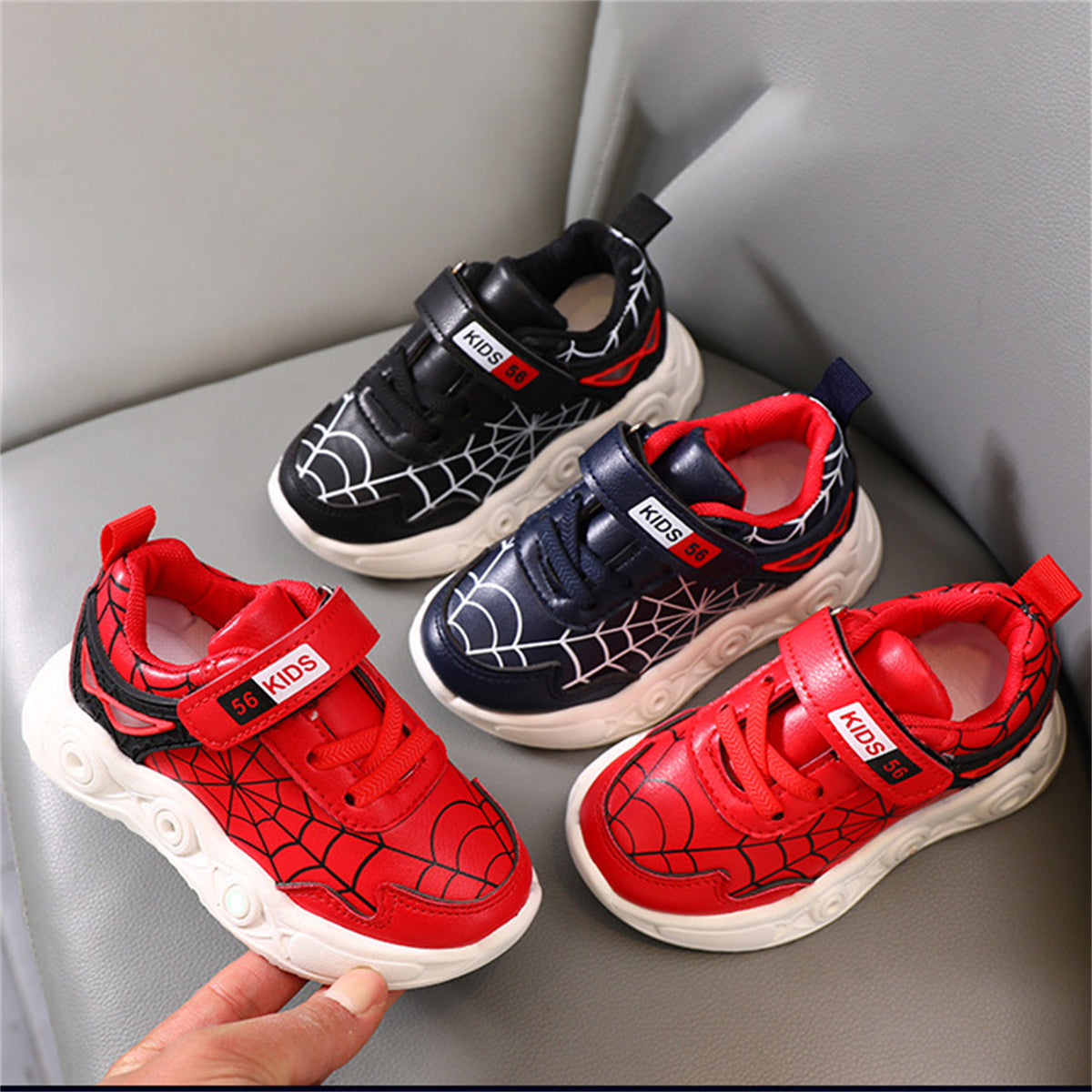 New children's cartoon sports shoes with lights in spring and autumn, leather spider web LED luminous children's shoes for 1-6 years old boys