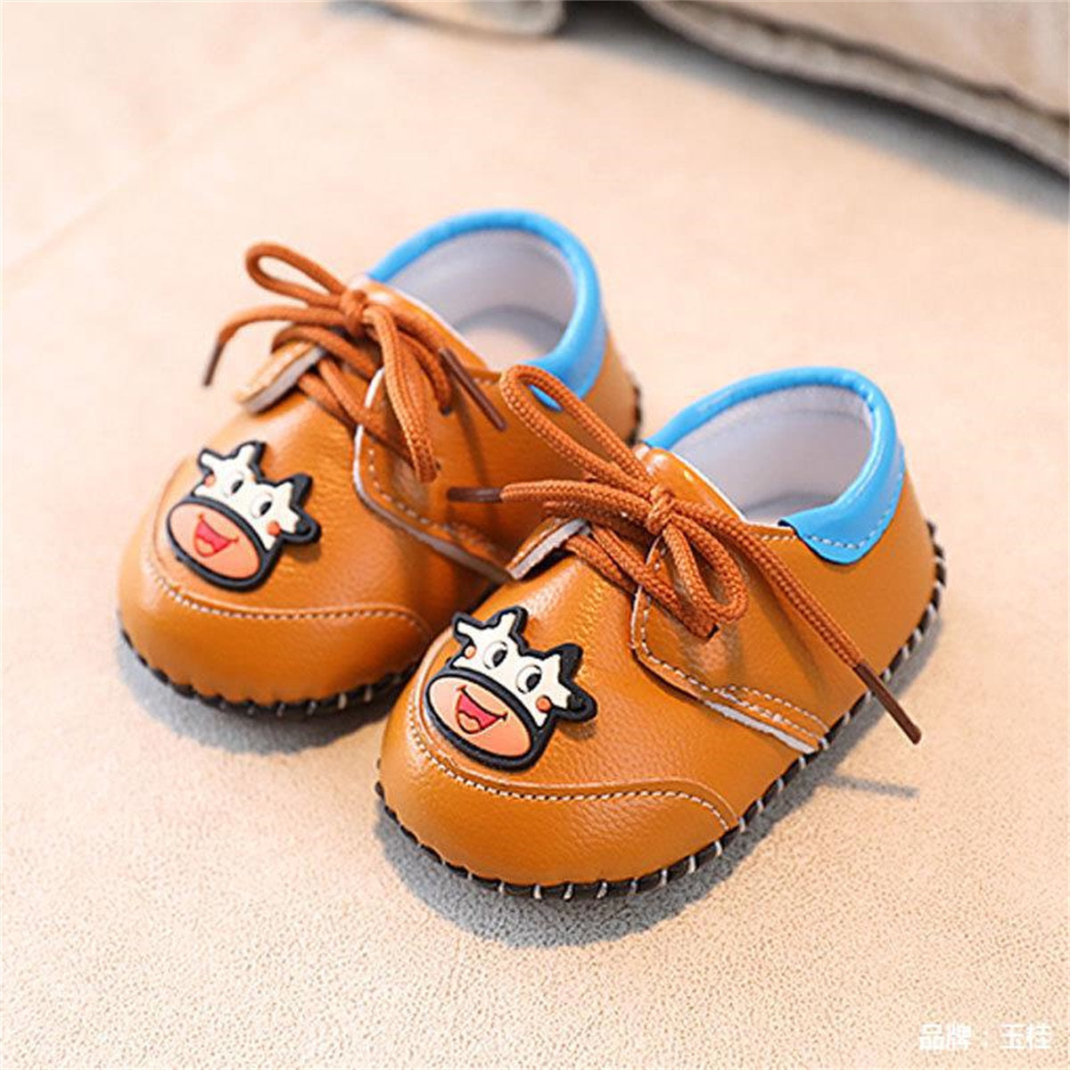 Cute calf pattern soft sole leather shoes for baby boys and girls