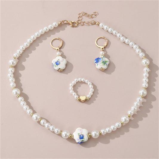 Children's 3-piece elegant temperament printed ceramic plum blossom shaped pearl jewelry set