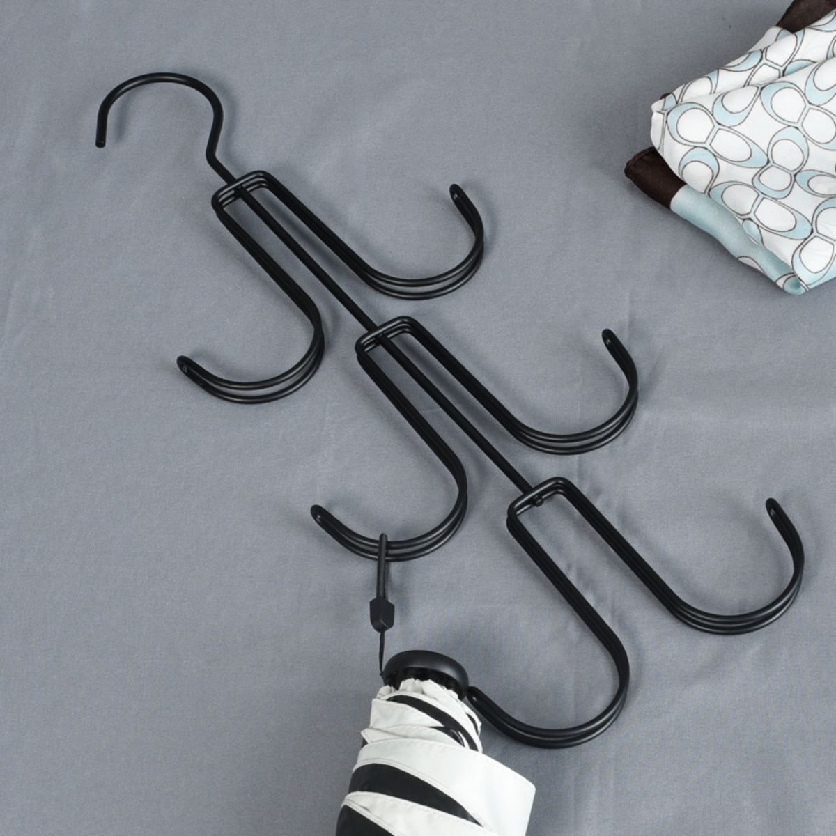 Multifunctional iron bag and coat hanger