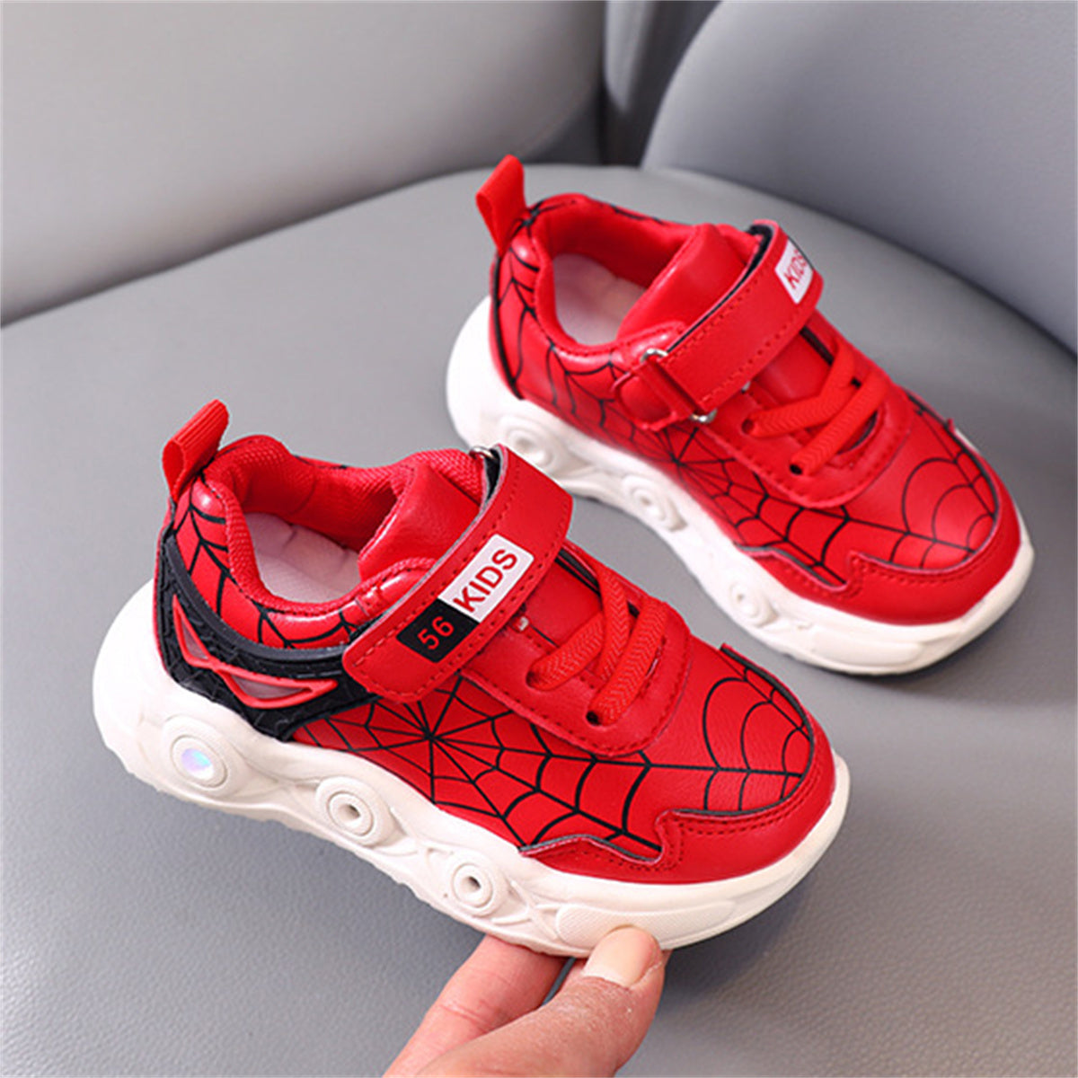 New children's cartoon sports shoes with lights in spring and autumn, leather spider web LED luminous children's shoes for 1-6 years old boys