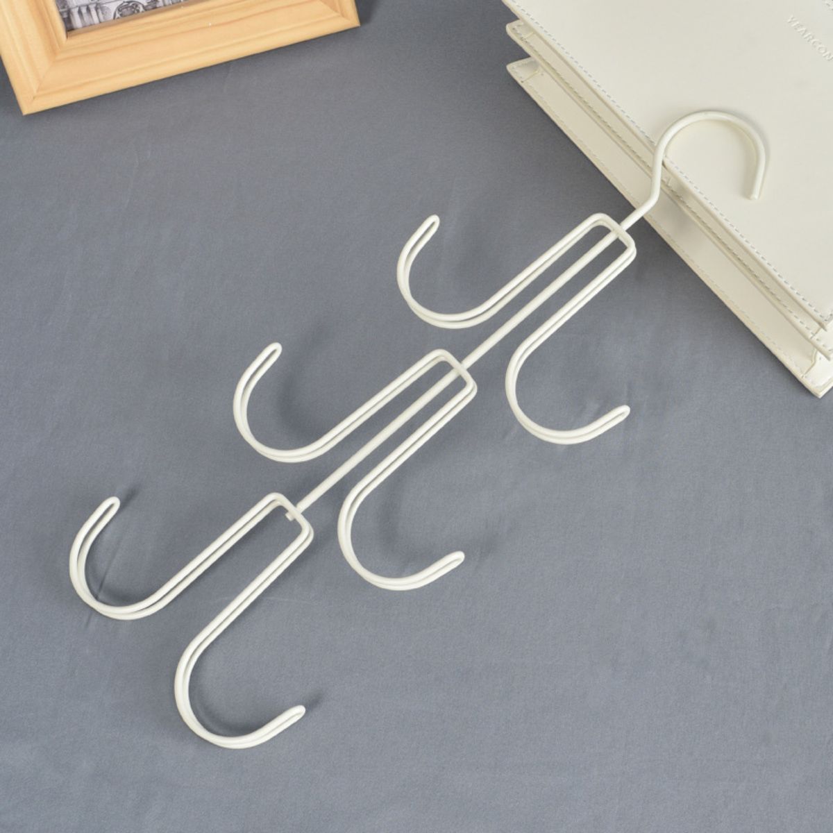 Multifunctional iron bag and coat hanger