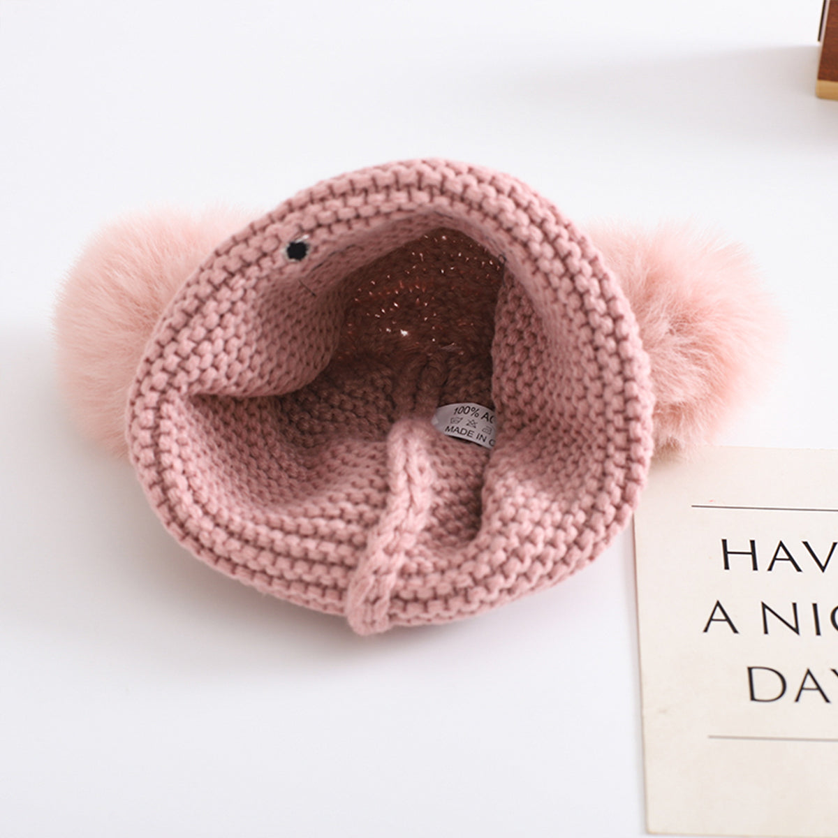 Children's woolen hat with fur ball