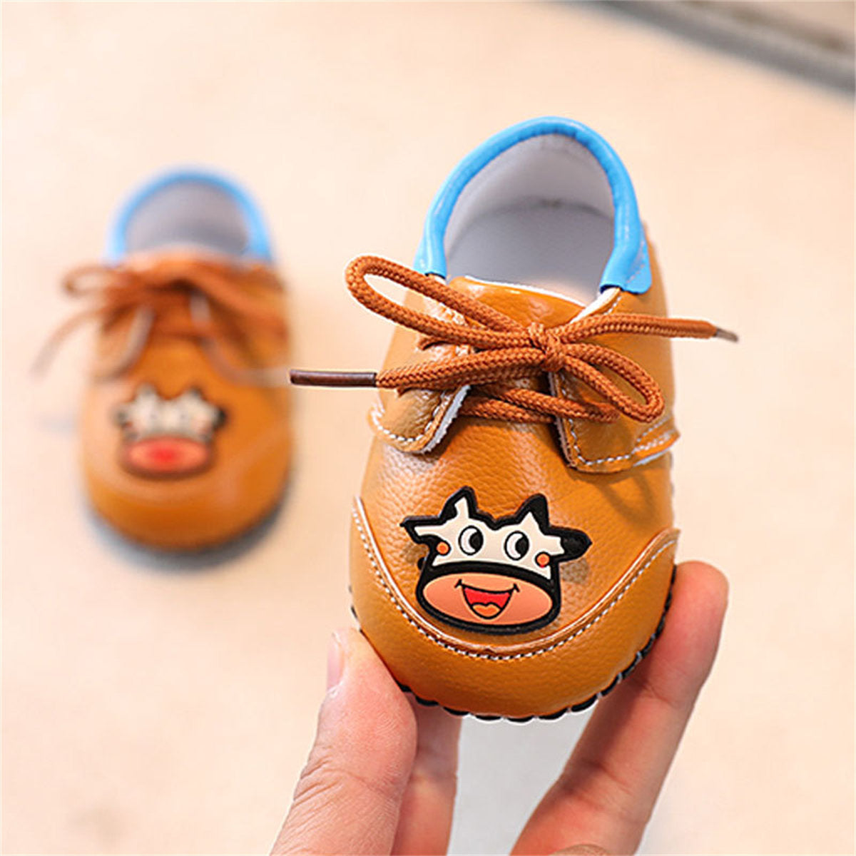 Cute calf pattern soft sole leather shoes for baby boys and girls